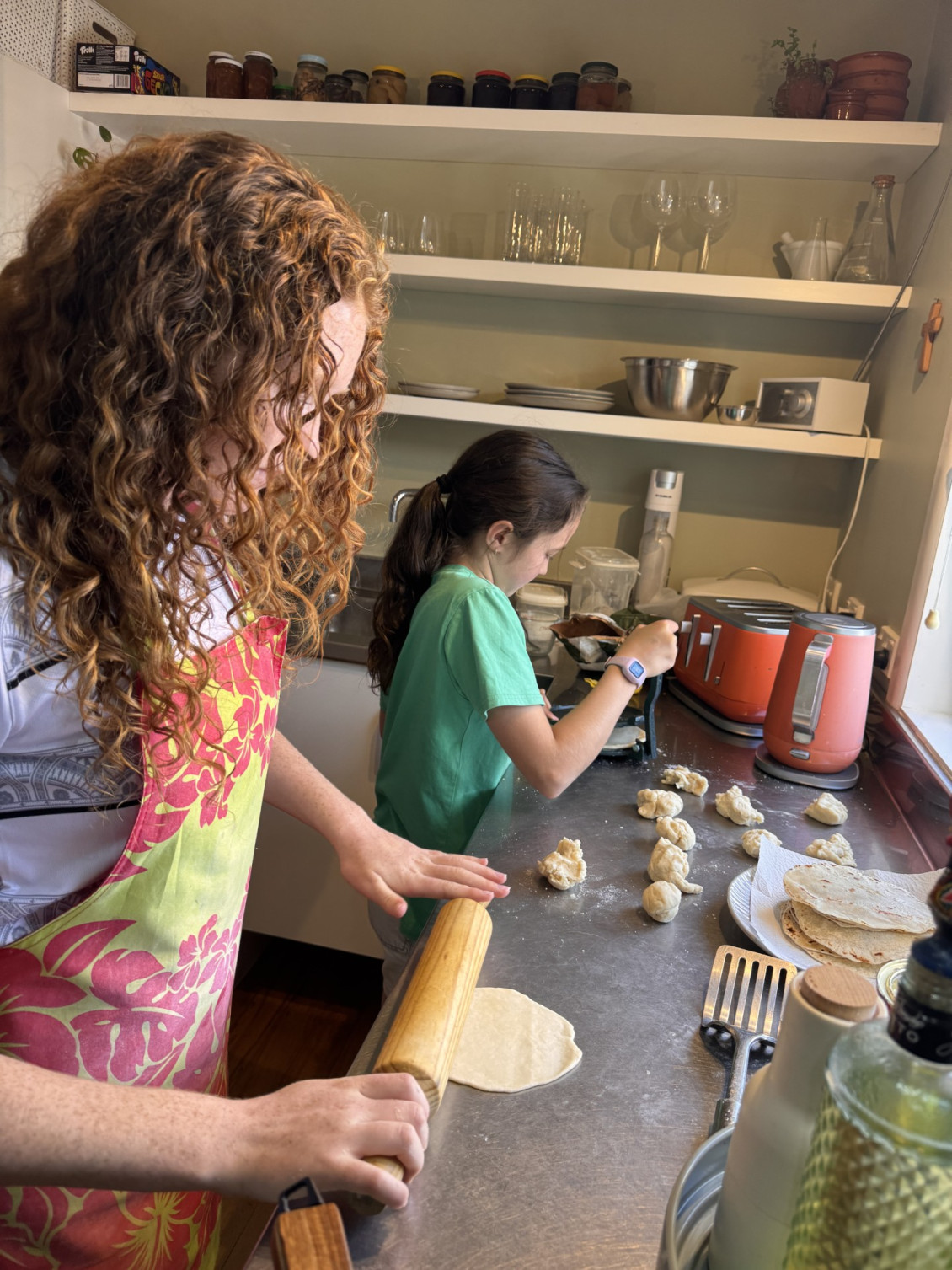 Talei and Milli making roti